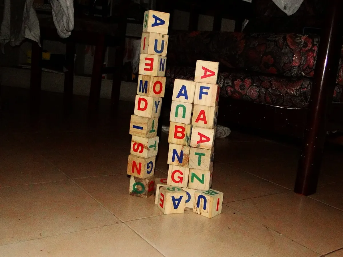Alphabet Learning App - A pile of alphabet wooden blocks