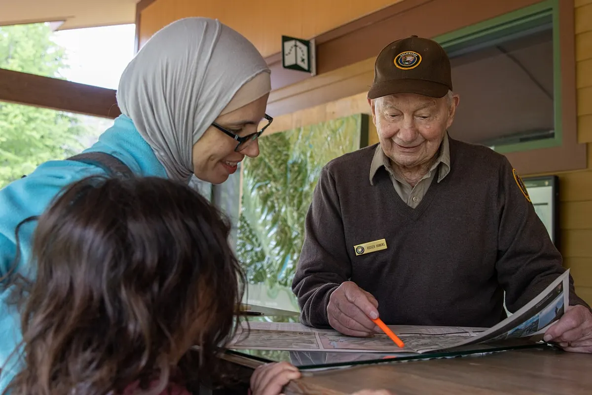 Charity Management System - A volunteer helping a visitor