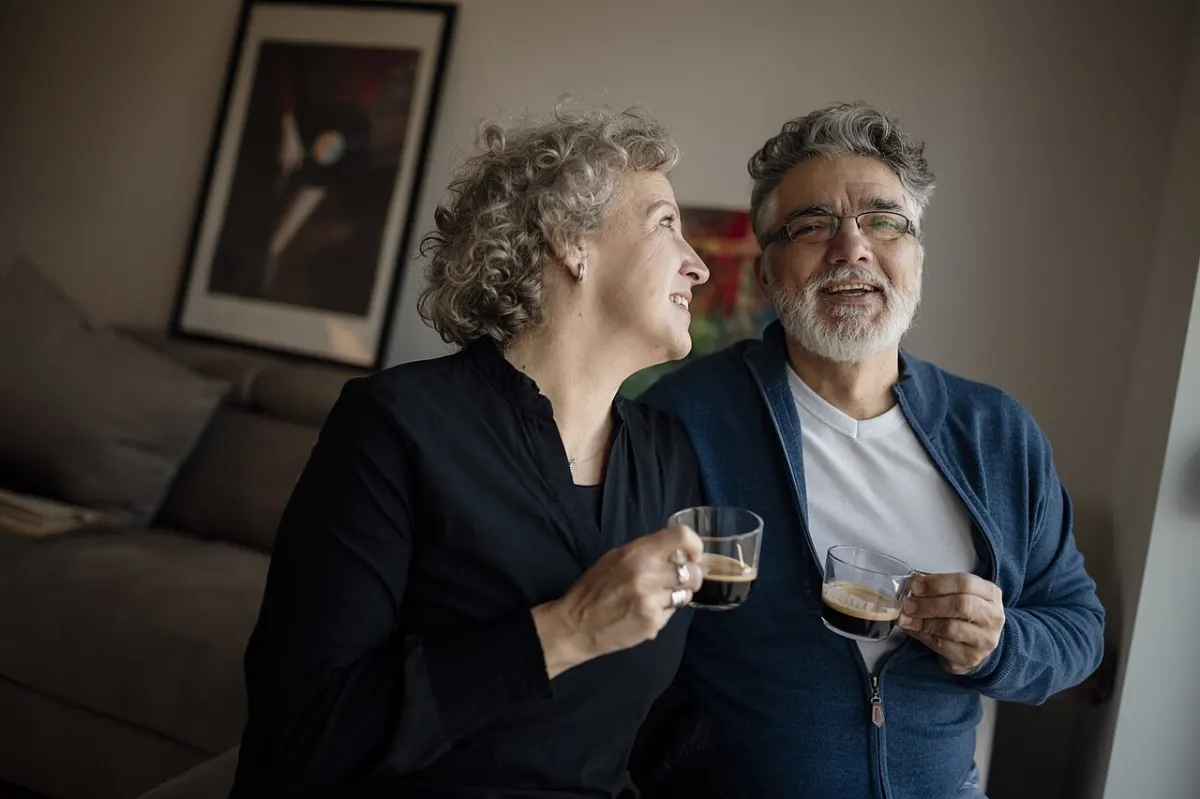 Dating & Matchmaking Portal - Couple enjoying coffee together in their cozy living room