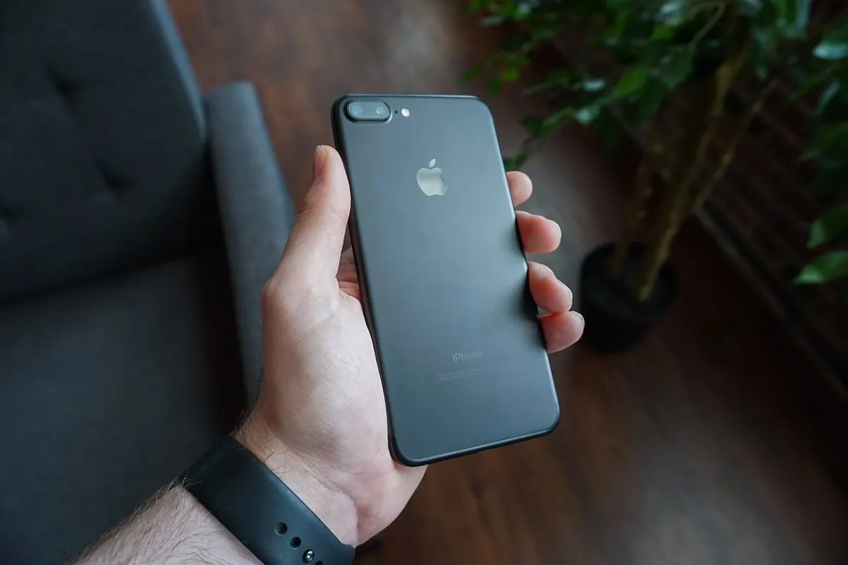 Expense Tracker App - Black smartphone in hand (Unsplash)