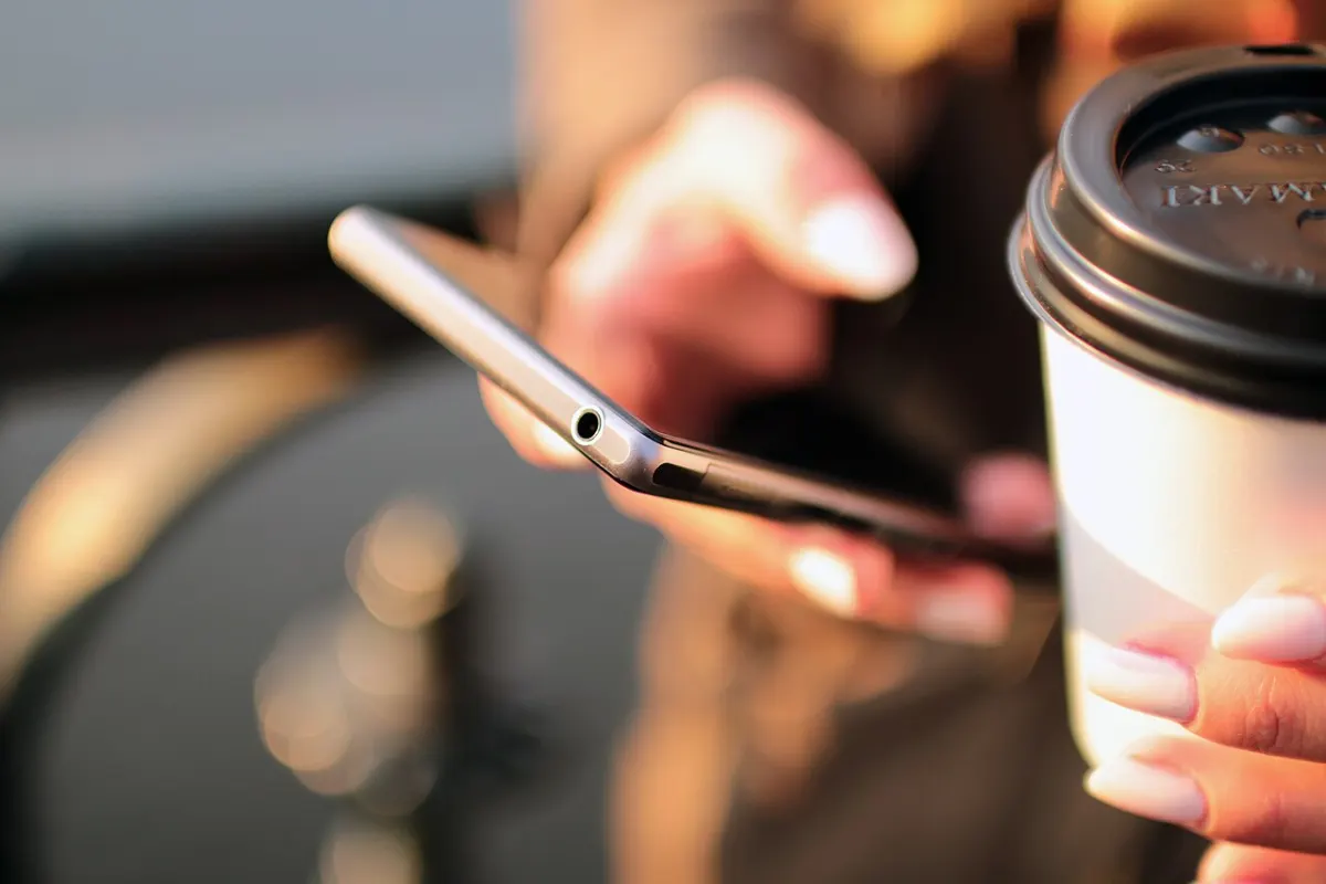 Expense Tracker App - Hands-coffee-smartphone-technology