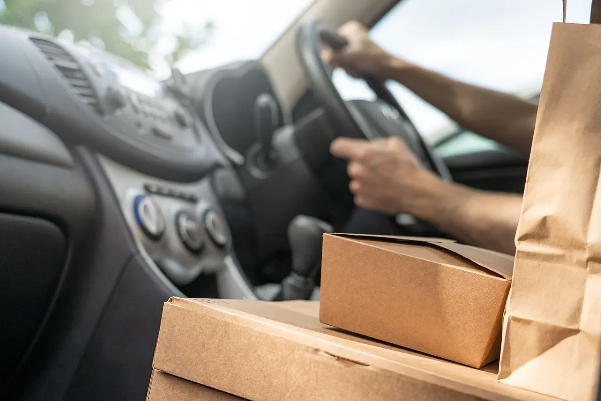 Food Ordering App - Food delivery driver delivering online order