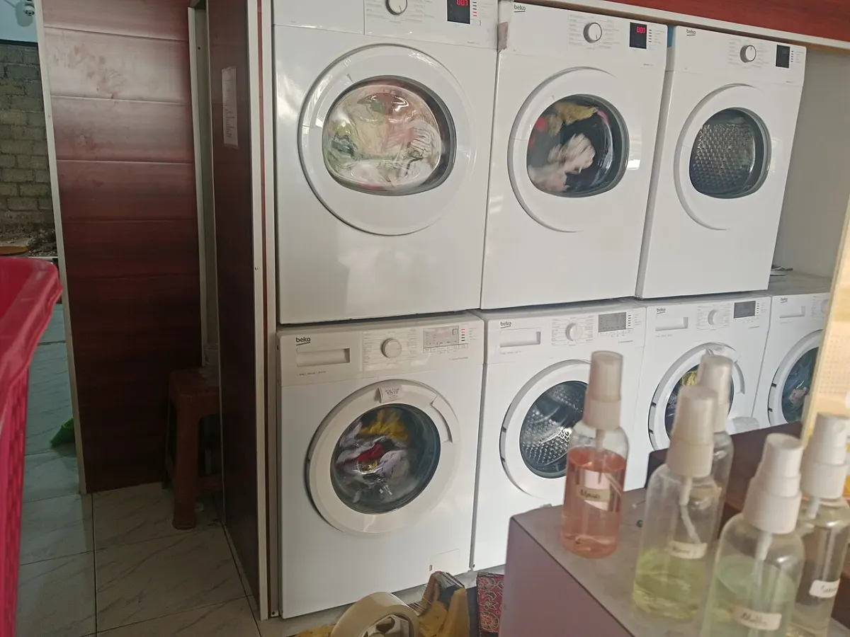 Laundry Management System - A collection of washing machines in a laundry shop
