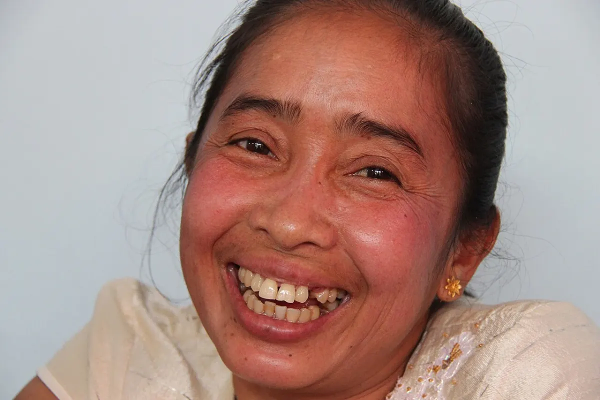 Meme Generator App - Laughing Laotian woman showing her teeth