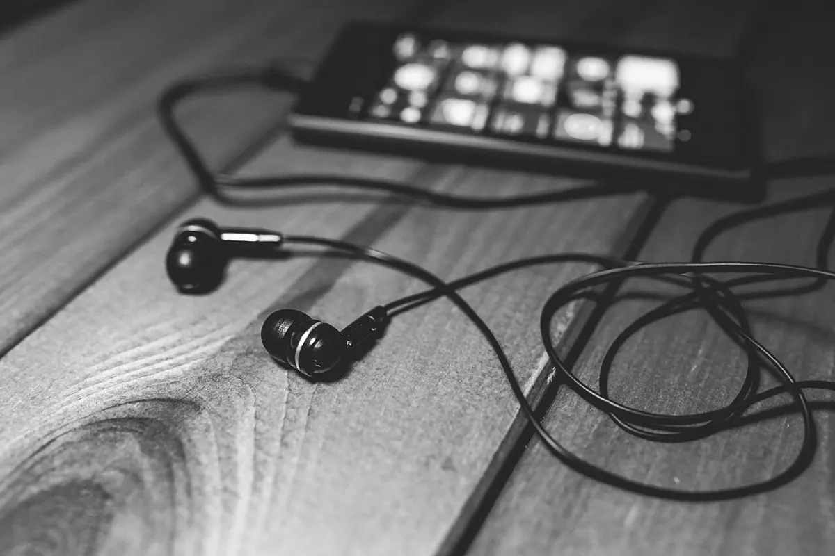 Online Music Streaming - Desk-music-headphones-earphones