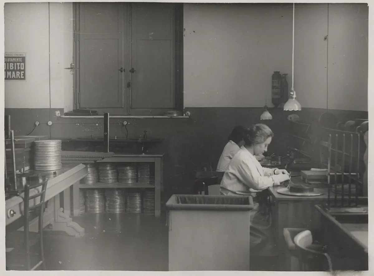 Photo Editor App - Photo Two female technicians at editing tables working on film reels 1930 - Touring Club I