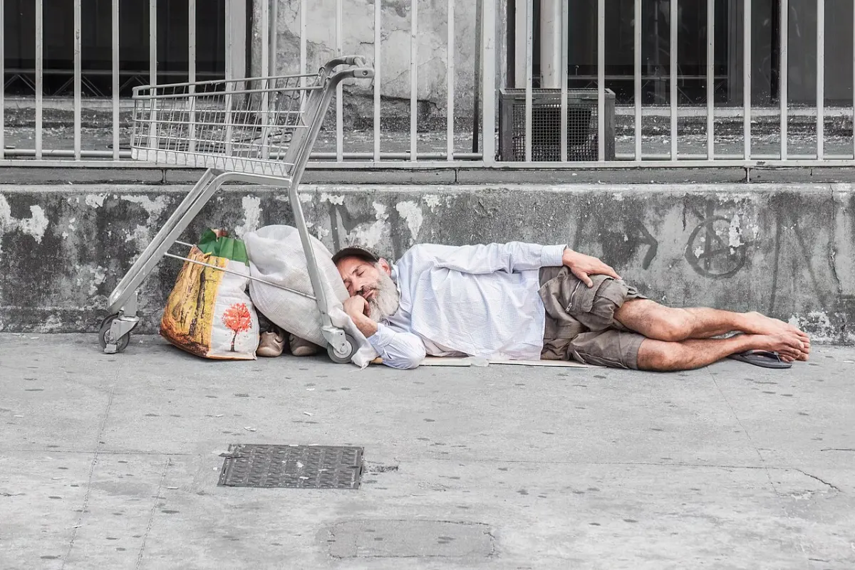 Sleep Monitoring Wearable - Person sleeping on Avenida Paulista, Sao Paulo city, Brazil