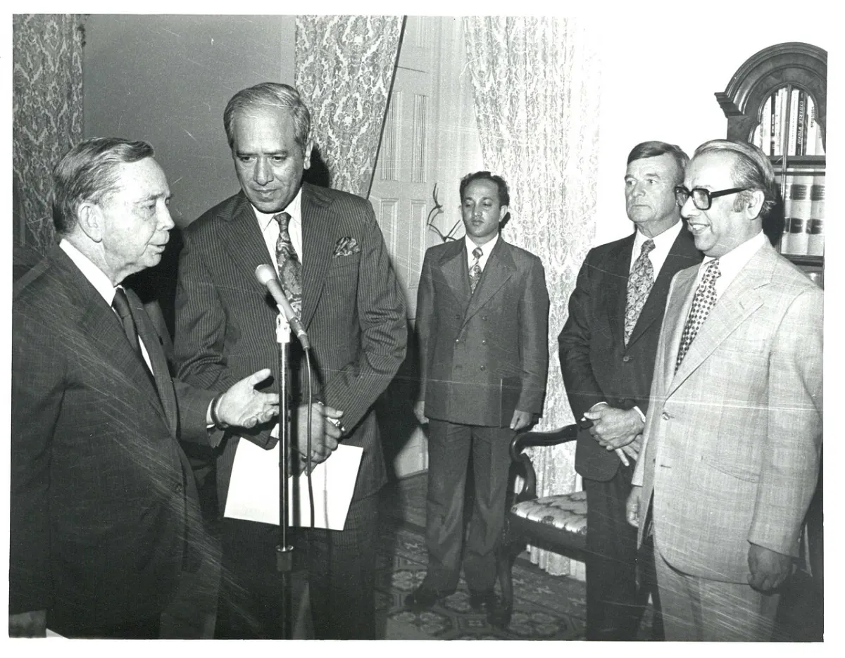 Speech-to-Text Tool - Carl Albert speaking into a microphone during the Bangladesh trip. July 1, 1972