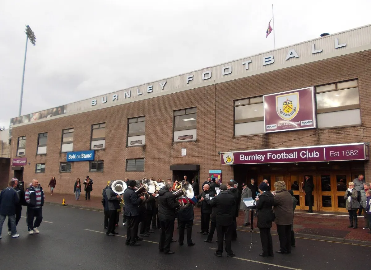 Sports Turf Booking System - Brass band outside Turf Moor football ground