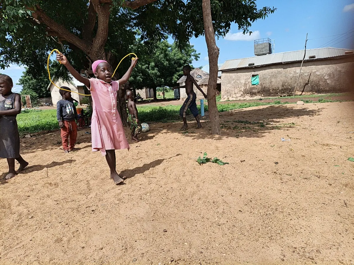 Tutor Finder App - Child playing at a community learning center where parents are teachers for their children